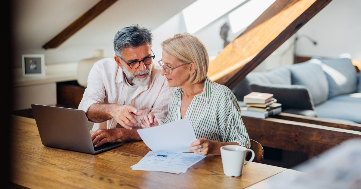 Couple doing pension paperwork Couple doing pension paperwork